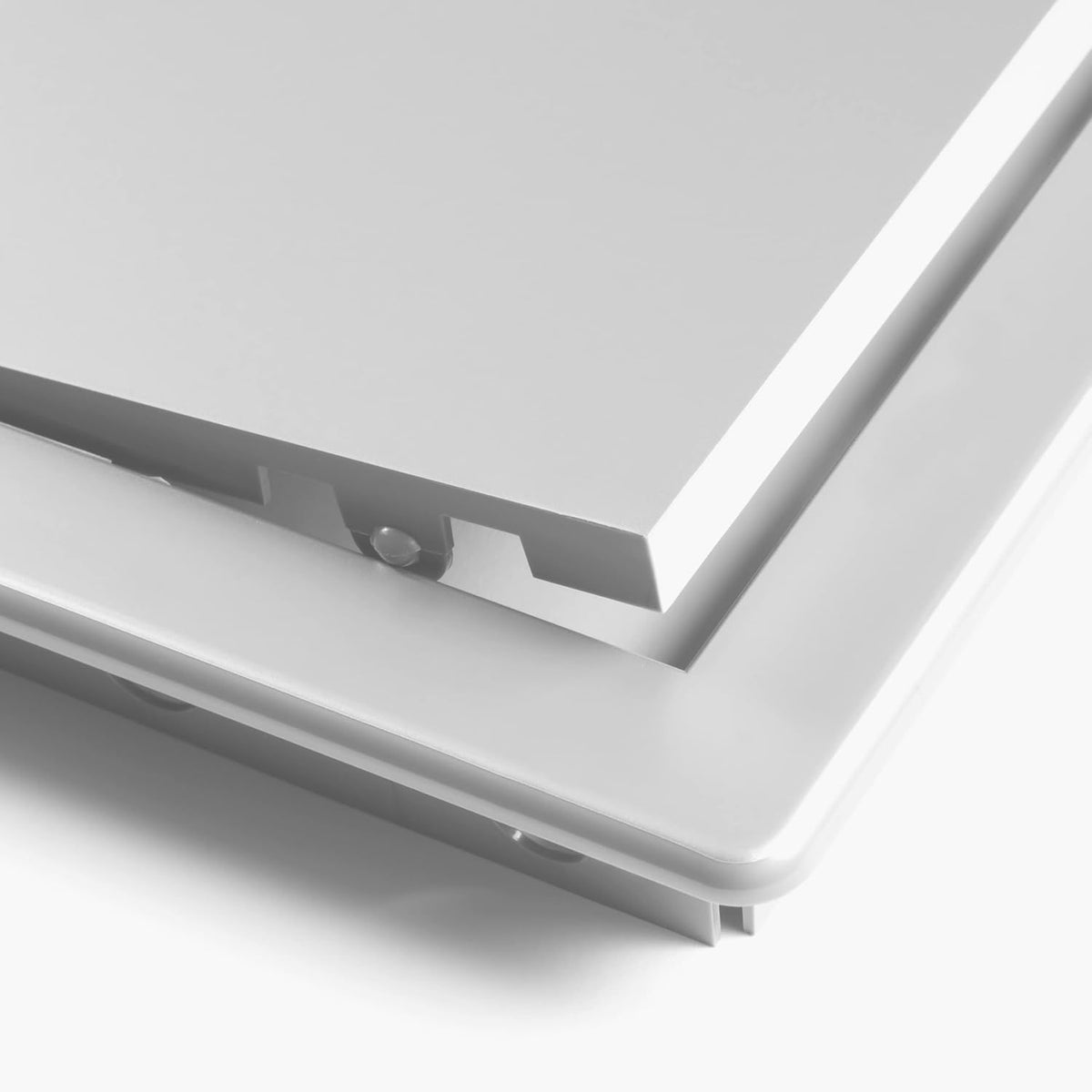 Close-up of Awenta white plastic access panel hinge mechanism.